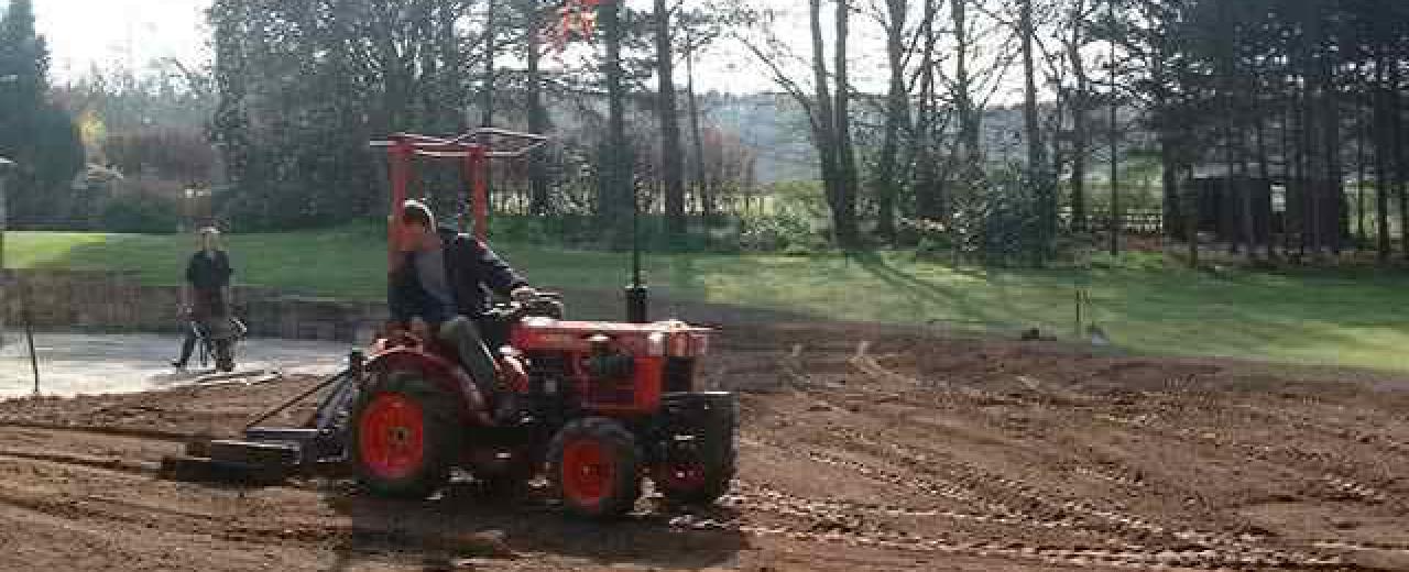 Grading lawn prior to sowing with grass seed Grading lawn prior to sowing with grass seed